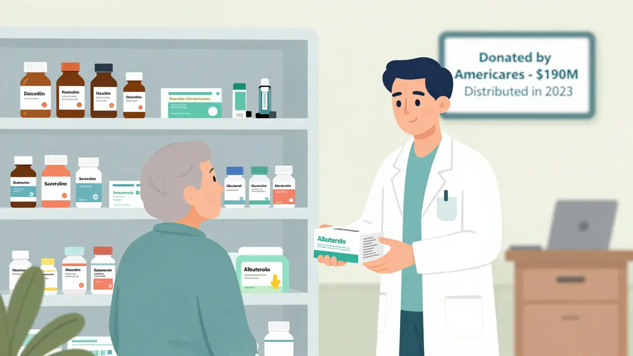 Volunteer pharmacist handing prescribed medications from a well-stocked clinic pharmacy shelf.